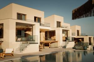 a rendering of a house with a swimming pool at Manas Villas in Elaiokhórion