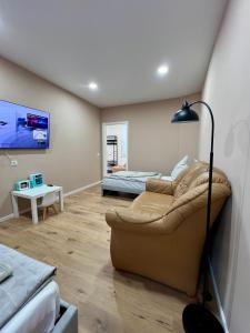 a living room with a couch and a bed at Apartment Marin in Bad Wildbad