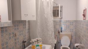 a small bathroom with a toilet and a sink at Apartman Iva in Kaštela +32 photos