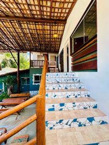 a set up for a wedding on the stairs of a house at Refugá in Porto Seguro