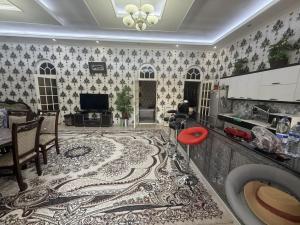 a living room with a kitchen and a living room at Dacha by Bex Sueno in Samarkand