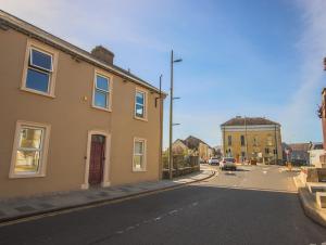 an empty street in a small town with buildings at East Bridge House in Enniskillen