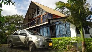 a car parked in front of a building at Valso Posada Campestre in Silvania