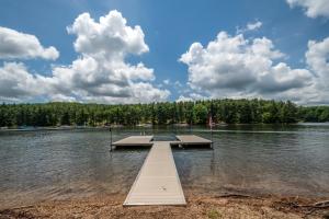 a dock in the middle of a lake at Swans Nest in Swanton