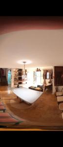 a living room with a large rug on the floor at Casa Maravilha in Aquiraz