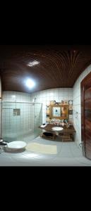 a bathroom with two sinks in a room at Casa Maravilha in Aquiraz +20 photos