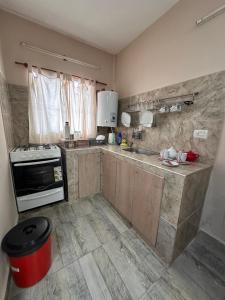 a kitchen with a sink and a stove at Finca Alta Gracia La Banda in La Banda