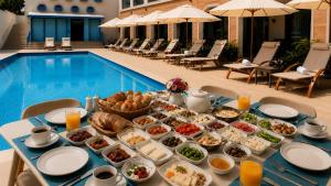 a buffet of food on a table next to a pool at Bluezone Club Residences by A'ila Resorts in Rodney Bay Village