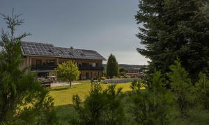 a house with solar panels on the roof at Villa Johannes in Warmensteinach