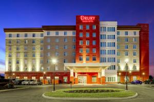 a hotel with a red sign on the front of it at Drury Plaza Hotel Cincinnati Florence in Florence