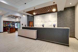 a restaurant with a counter in a lobby at Drury Plaza Hotel Cincinnati Florence in Florence +56 photos