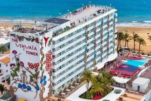 an aerial view of the virginia tower at the beach at Apt in Playa den Bossa next Ushuaia, beachfront, reliable host in Ibiza Town