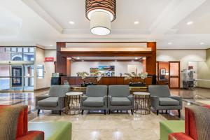 a lobby of a hospital with chairs and tables at Drury Inn & Suites St. Louis Forest Park in Saint Louis