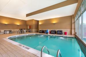 a large indoor pool in a hotel room at Drury Inn & Suites St. Louis Forest Park in Saint Louis