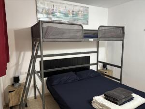 a bedroom with two bunk beds in a room at Apt in Playa den Bossa next Ushuaia, beachfront, reliable host in Ibiza Town +126 photos