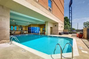 a large swimming pool in front of a building at Drury Inn & Suites Montgomery in Montgomery