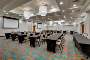 a conference room with black tables and chairs in it at Drury Inn & Suites Montgomery in Montgomery