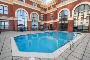 a large swimming pool in front of a building at Drury Plaza Hotel New Orleans in New Orleans