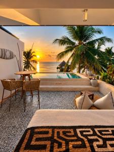 a bedroom with a view of the ocean at Villa Duara Zanzibar Rooftop Infinity Pool The Rock View in Michamvi