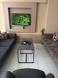 a living room with a couch and a coffee table at Pendik ar Marmaray Pet Friendly in Istanbul