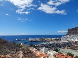 a view of a city and the ocean at Playa de Mogán in Playa del Cura