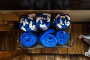 a bunch of blue and white towels on a shelf at Hideaway Above The Stream Sundance, Utah in Sundance +41 photos