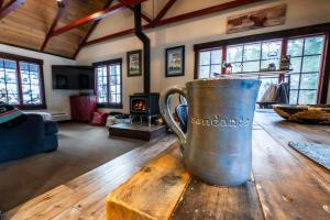 a coffee cup sitting on a wooden table in a living room at Hideaway Above The Stream Sundance, Utah in Sundance