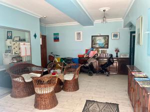 a living room with wicker chairs and a table at Delphin Hotel Side in Side