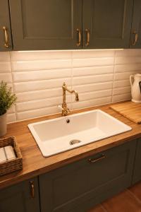 a sink with a faucet on top of a counter at Casa Il Borgo 1 in Tavernelle