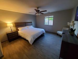 a bedroom with a bed and a ceiling fan at Family 4BR Home with Spacious Backyard in Coachella