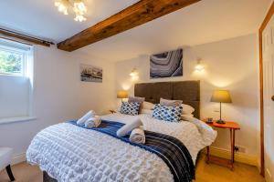 a bedroom with a large bed with towels on it at 1 Bed in Richmond oc-44401 in Reeth