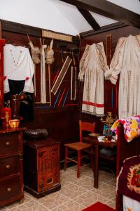 a room with clothes hanging on a wall at Izletište Ružić in Mrčajevci
