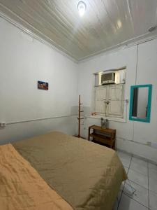 a bedroom with a bed and a tv in it at Casa Art Maison Recife in Recife