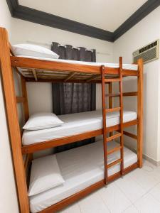 a couple of bunk beds in a room at Casa Art Maison Recife in Recife