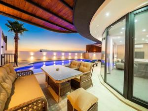 a living room with a couch and a table at Villa Ocak 1 in Kaş