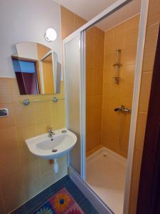 a bathroom with a sink and a shower at Eleni Pokoje Gościnne in Bukowina Tatrzańska +23 photos