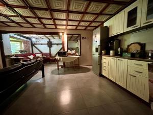 a kitchen with a table in the middle of a room at Gościniec Saba in Zieleniec +26 photos