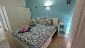 a bedroom with a bed with a black and white comforter at Da Rocha Beach 8, SEA VIEW in Portimão