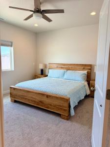 a bedroom with a bed and a ceiling fan at Desert Sun Oasis in Page