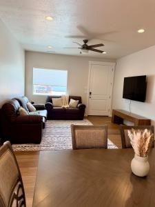 a living room with a couch and a table at Desert Sun Oasis in Page