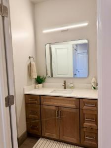 a bathroom with a sink and a mirror at Desert Sun Oasis in Page +42 photos