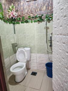 a bathroom with a toilet and a shower at CBR Beach in Kota Belud +13 photos