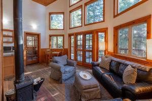 a living room with a couch and a stove at Green Springs Inn in Ashland