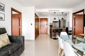 a living room with a couch and a glass table at THE VIEW AT RIVEFRONT by Bahama Rentals in Guayaquil