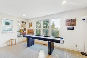 a living room with a pool table in it at Pinetree Palace in Lake Arrowhead