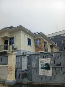 a house with a fence in front of it at Soulluxury Apartment in Lekki