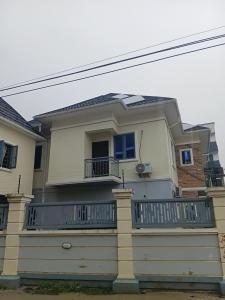 a large white house with a balcony at Soulluxury Apartment in Lekki