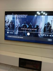 a flat screen tv sitting on top of a dresser at Soulluxury Apartment in Lekki