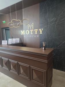 a lobby of a hotel with a reception desk at Motty Residence in Vicovu de Sus
