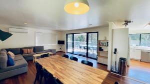 a living room with a couch and a table at Ammaboolah at Hat Head - 36 Hutcheson Street in Hat Head